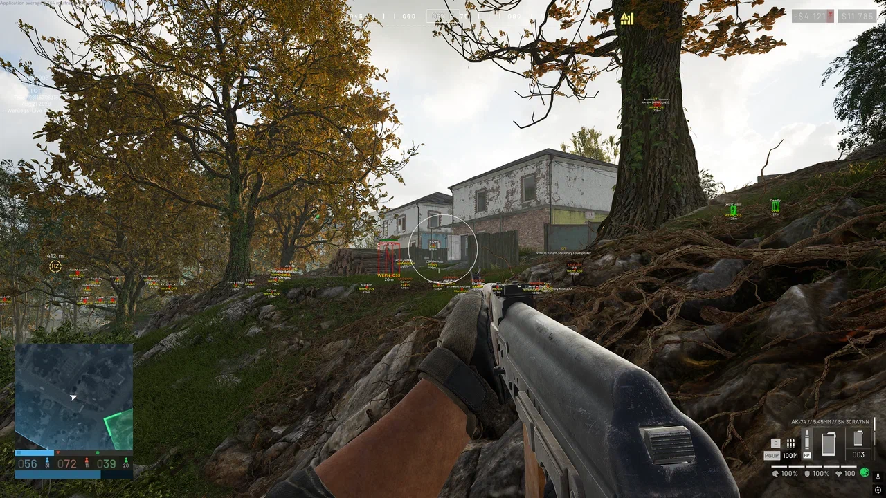 WARDOGS gameplay with long-range player markers near buildings and trees